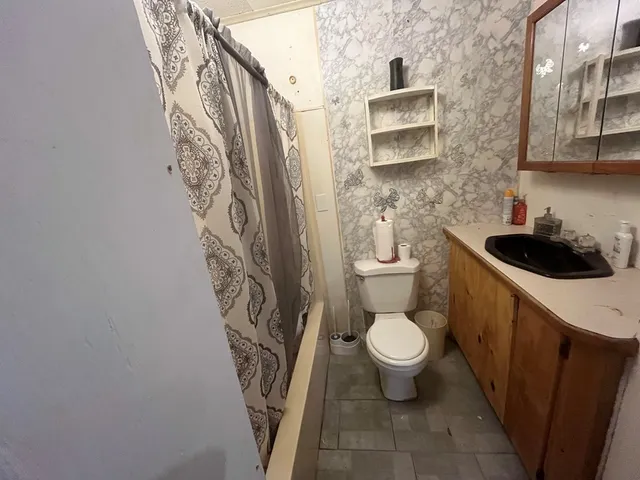 a bathroom with a toilet and a sink
