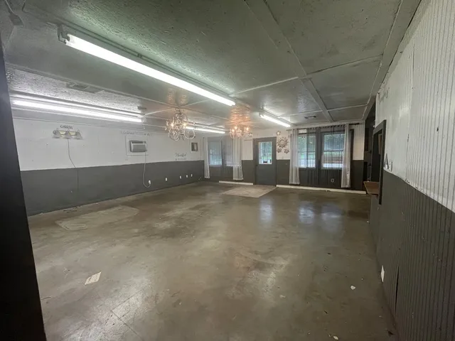 a view of a hallway with chandelier