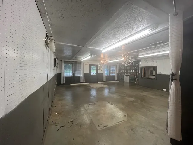 a view of a hallway with seating area