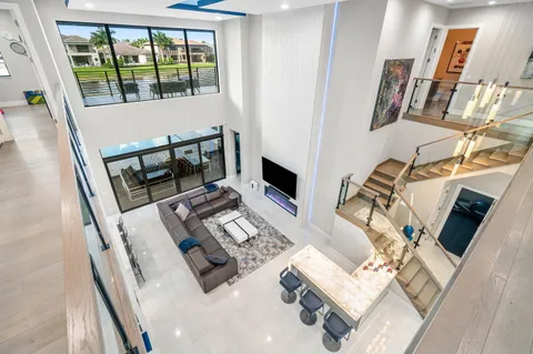 a kitchen with stainless steel appliances a sink a stove top oven a counter space and cabinets