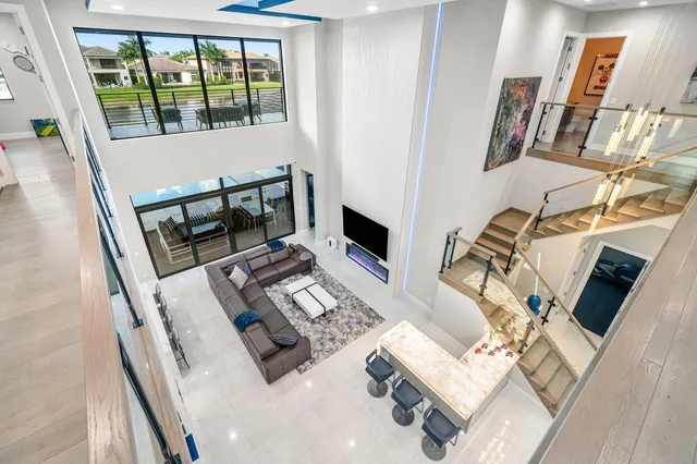 a kitchen with stainless steel appliances a sink a stove top oven a counter space and cabinets