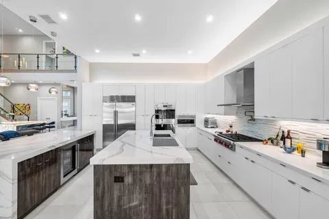 a bedroom with a bed and large window