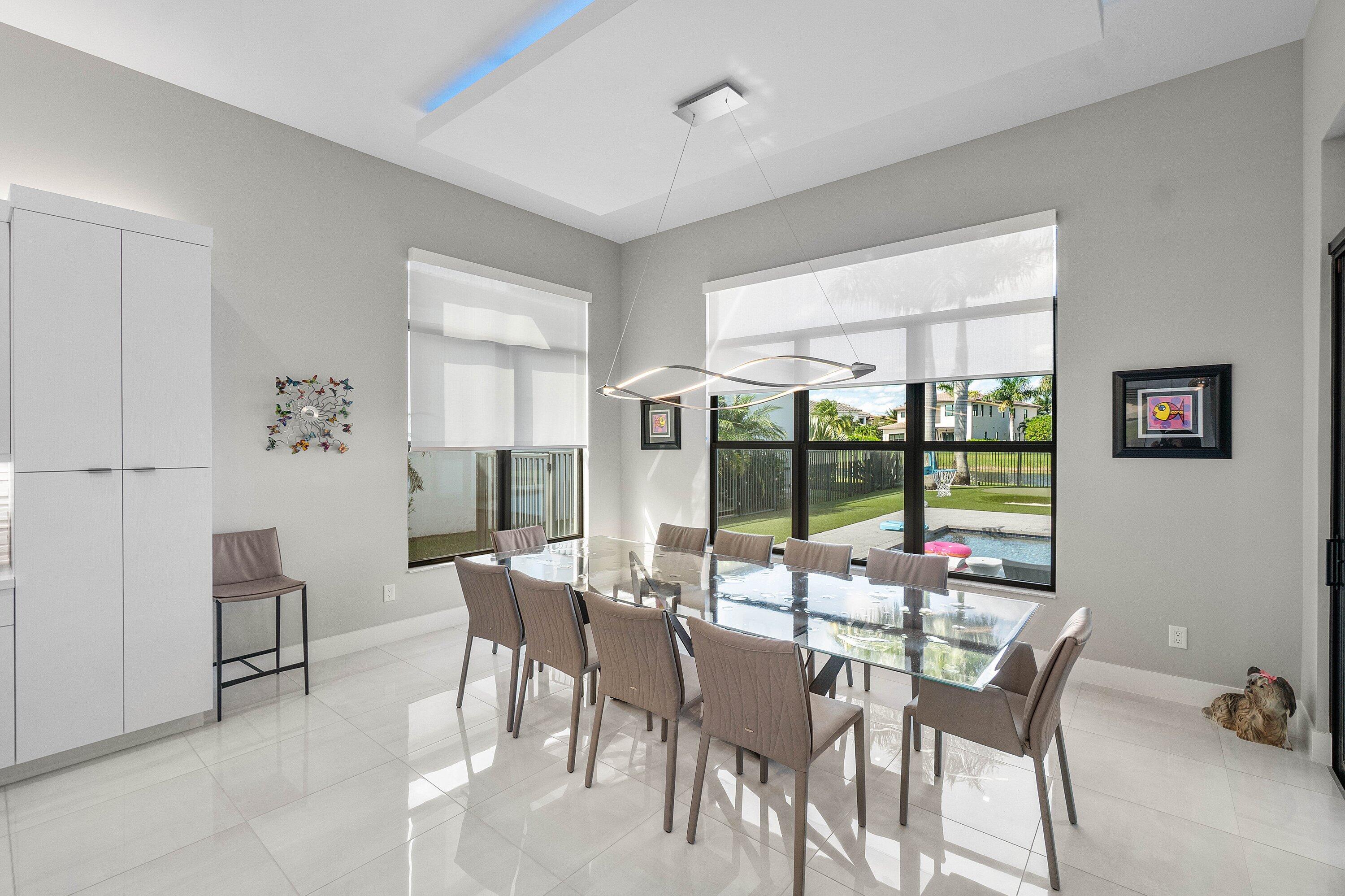 9657 Vescovato Way Boca Raton, FL 33496 - Photo 19 of 68 a view of a dining room with furniture window and outside view