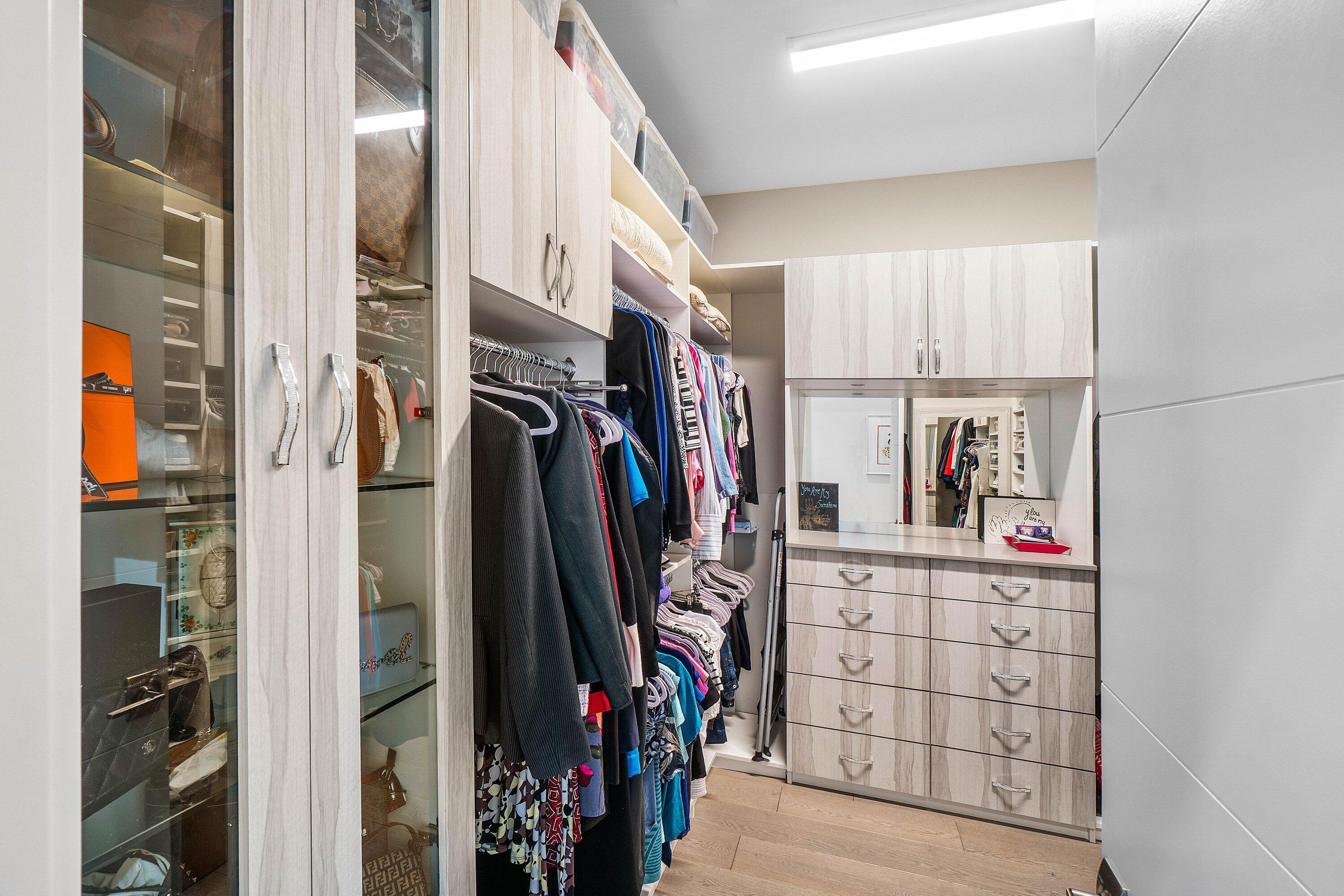 9657 Vescovato Way Boca Raton, FL 33496 - Photo 22 of 68 a view of walk in closet with clothes