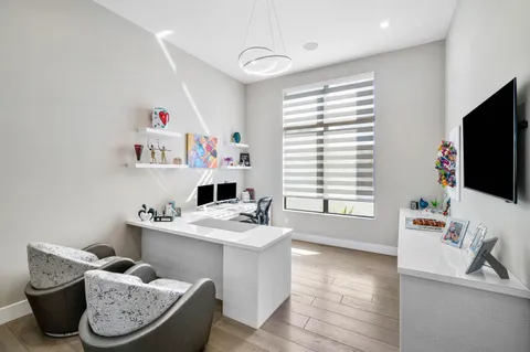 a bedroom with a bed and a table