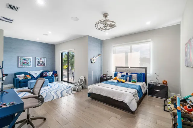 a living room with furniture toys and a flat screen tv