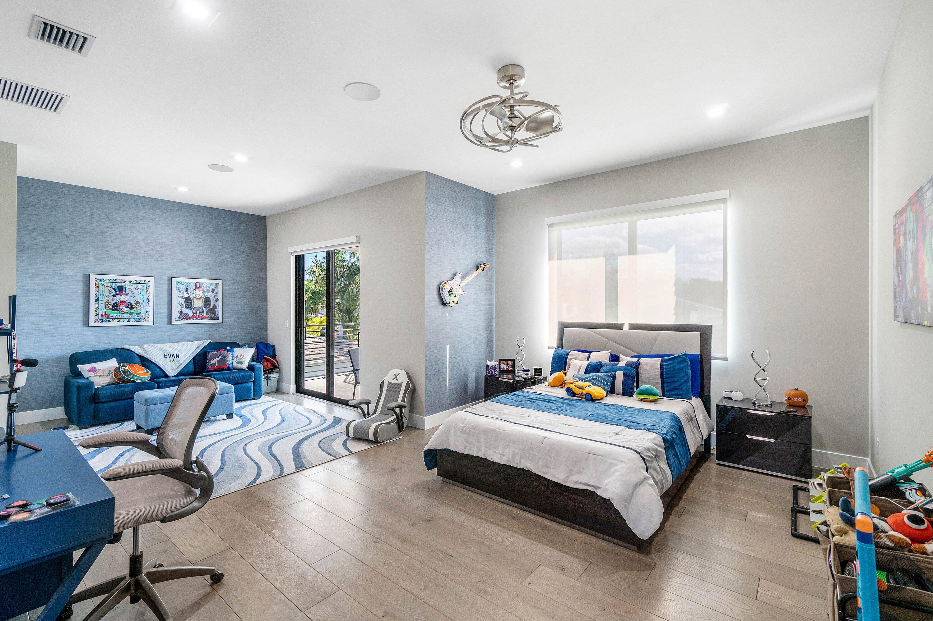 9657 Vescovato Way Boca Raton, FL 33496 - Photo 39 of 68 a bedroom with a bed and a chandelier