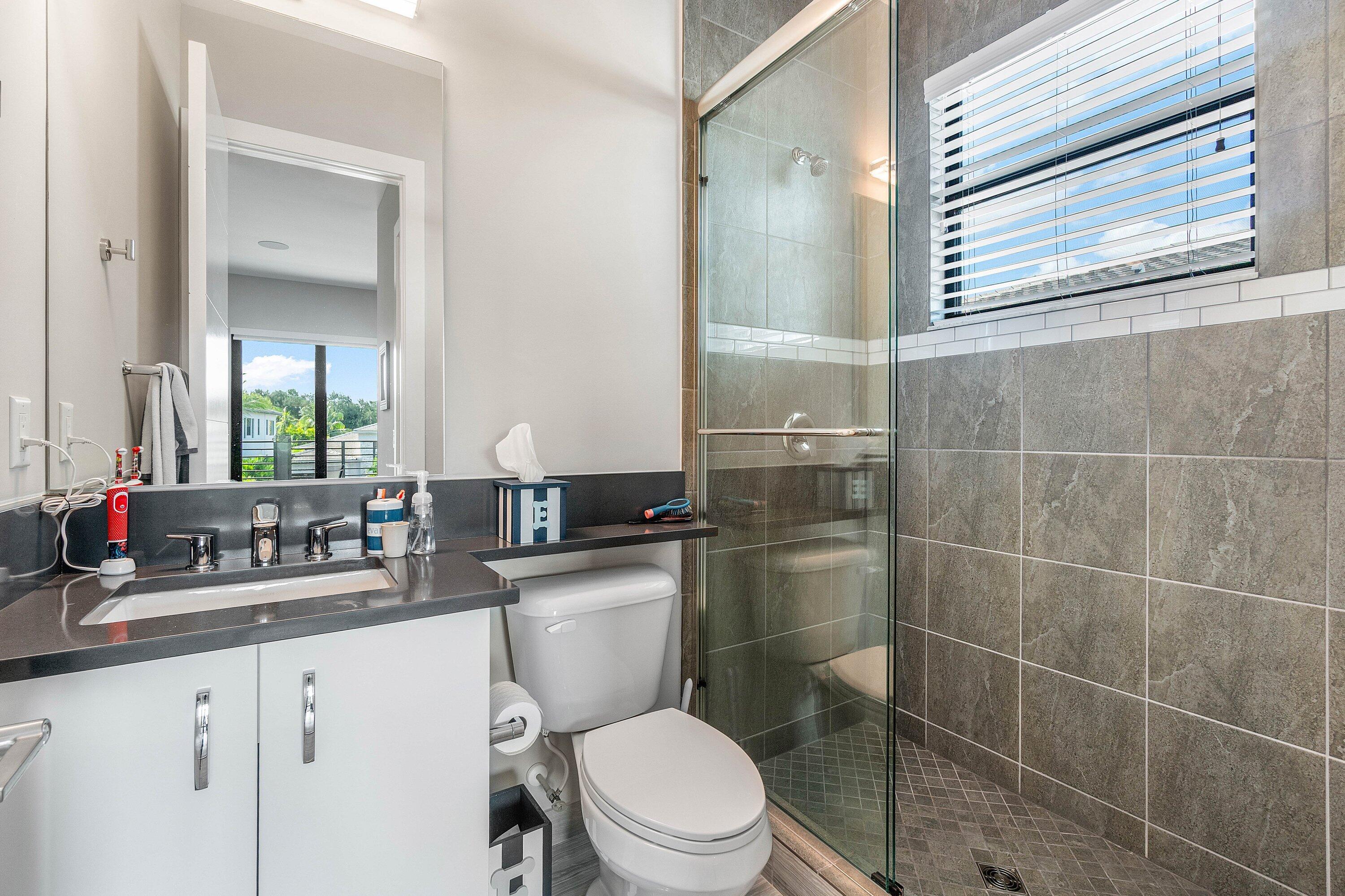 9657 Vescovato Way Boca Raton, FL 33496 - Photo 41 of 68 a bathroom with a toilet a sink and shower