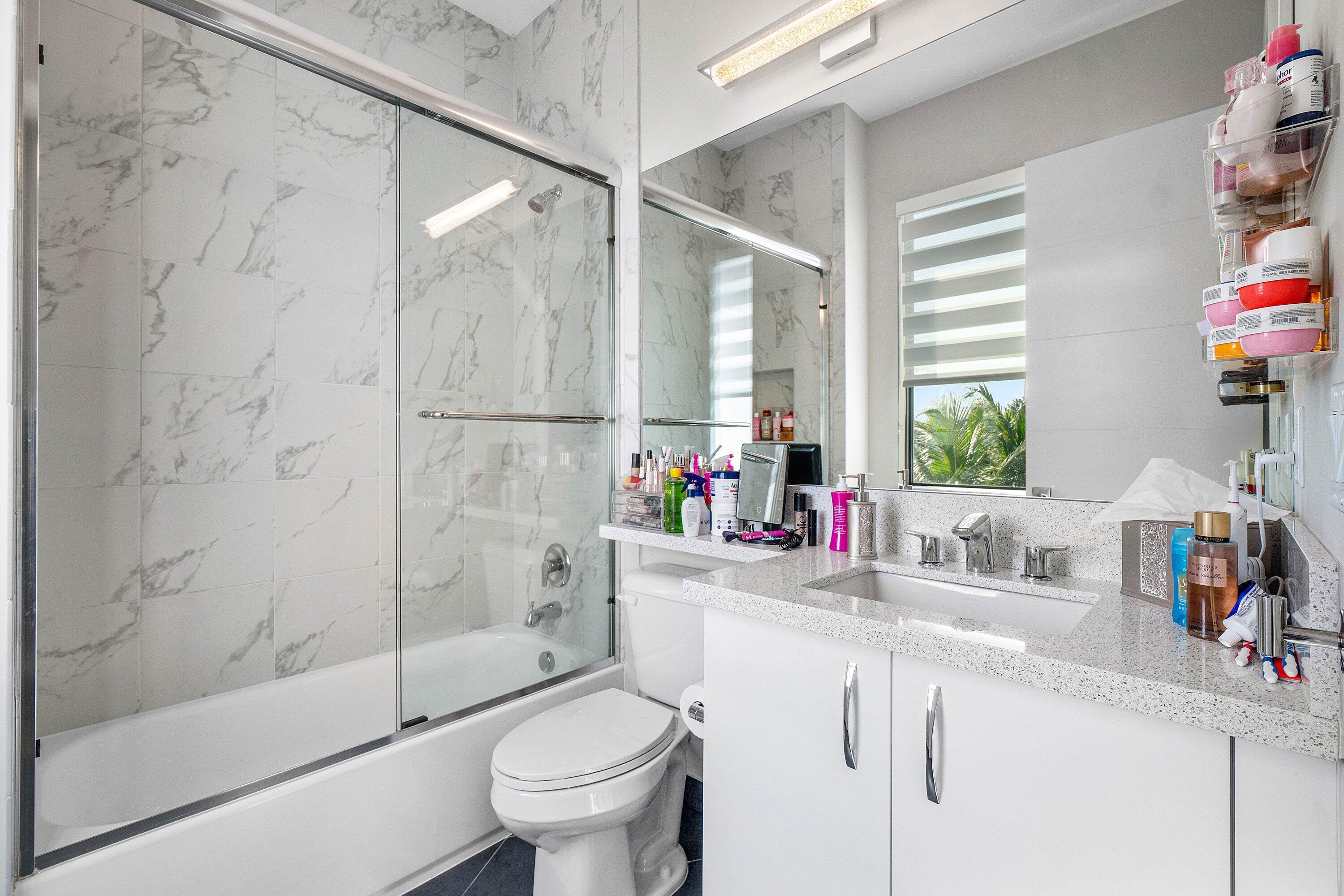 9657 Vescovato Way Boca Raton, FL 33496 - Photo 44 of 68 a bathroom with a sink toilet and shower