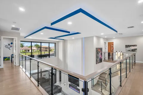 a view of a house with swimming pool and porch