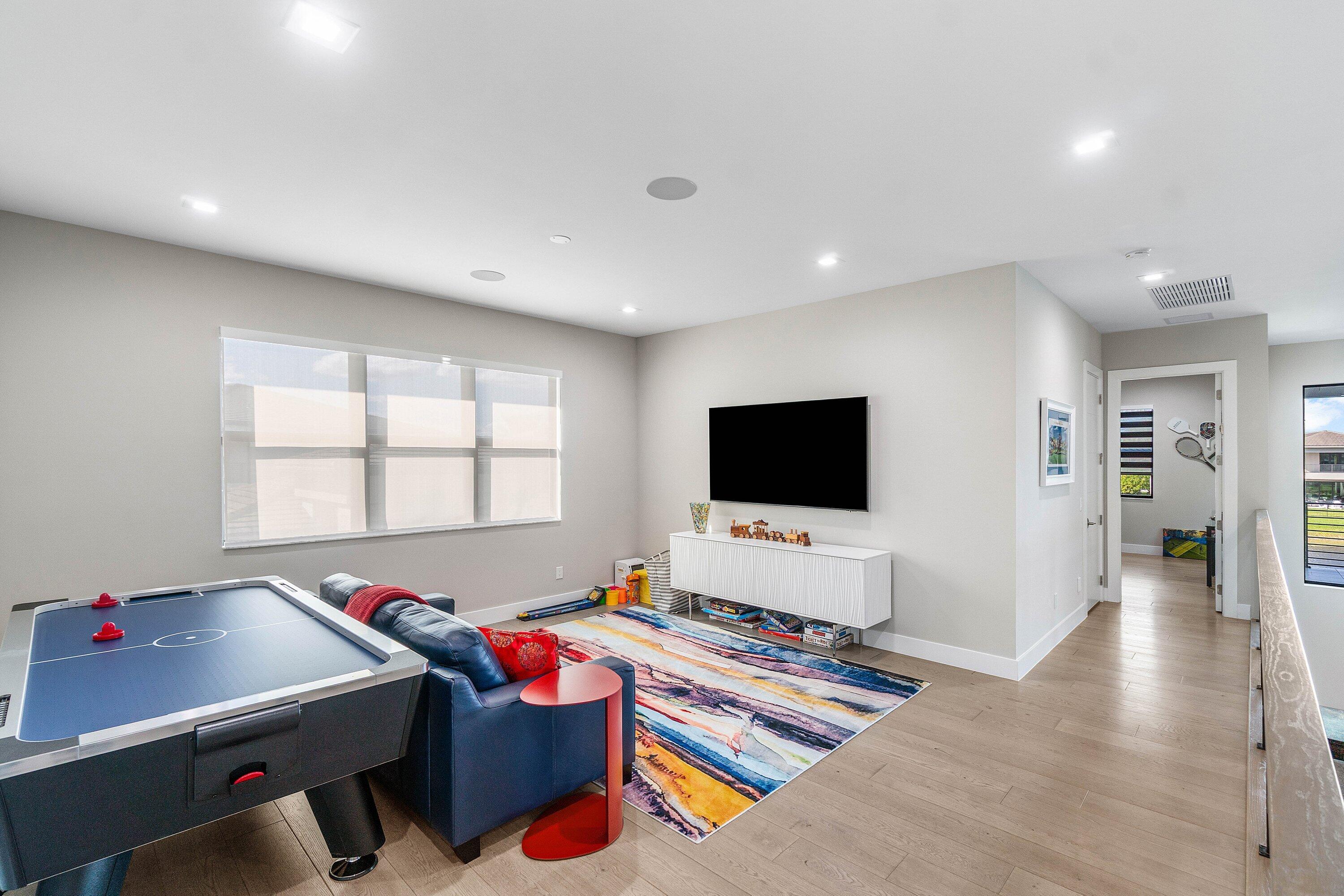 9657 Vescovato Way Boca Raton, FL 33496 - Photo 47 of 68 a living room with furniture and a flat screen tv