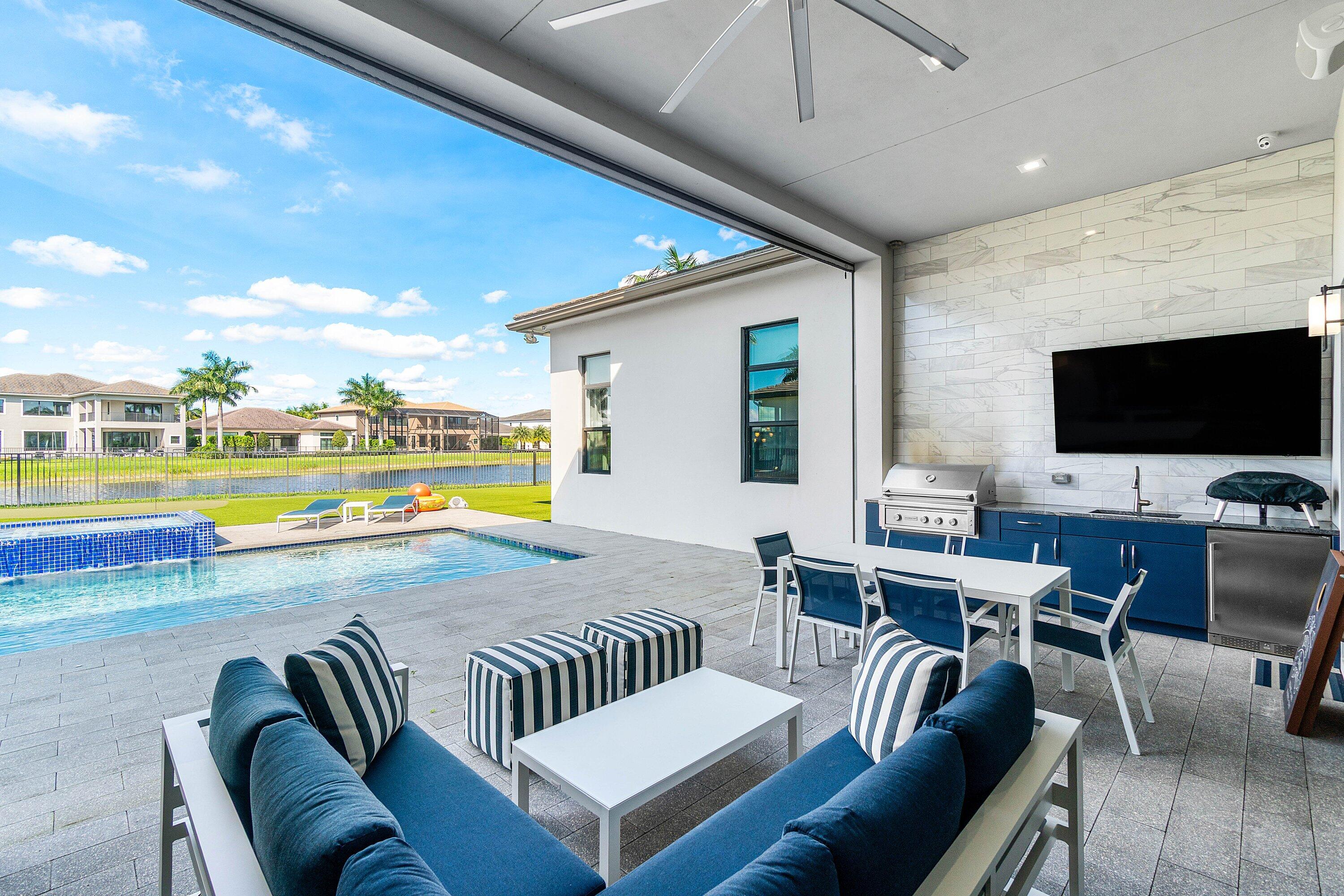 9657 Vescovato Way Boca Raton, FL 33496 - Photo 52 of 68 a living room with furniture and a flat screen tv
