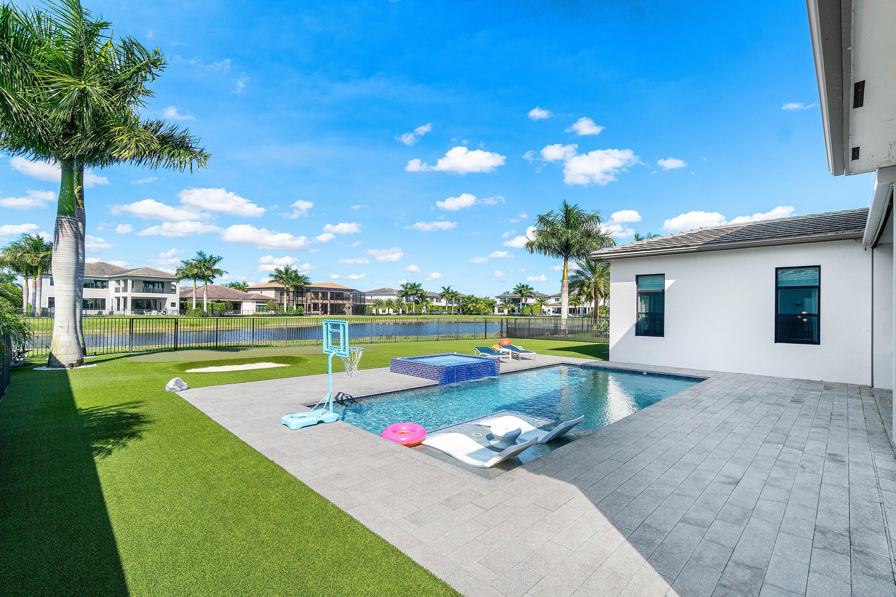 9657 Vescovato Way Boca Raton, FL 33496 - Photo 56 of 68 a view of a patio with swimming pool