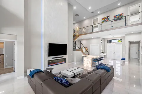 a living room with furniture and flat screen tv