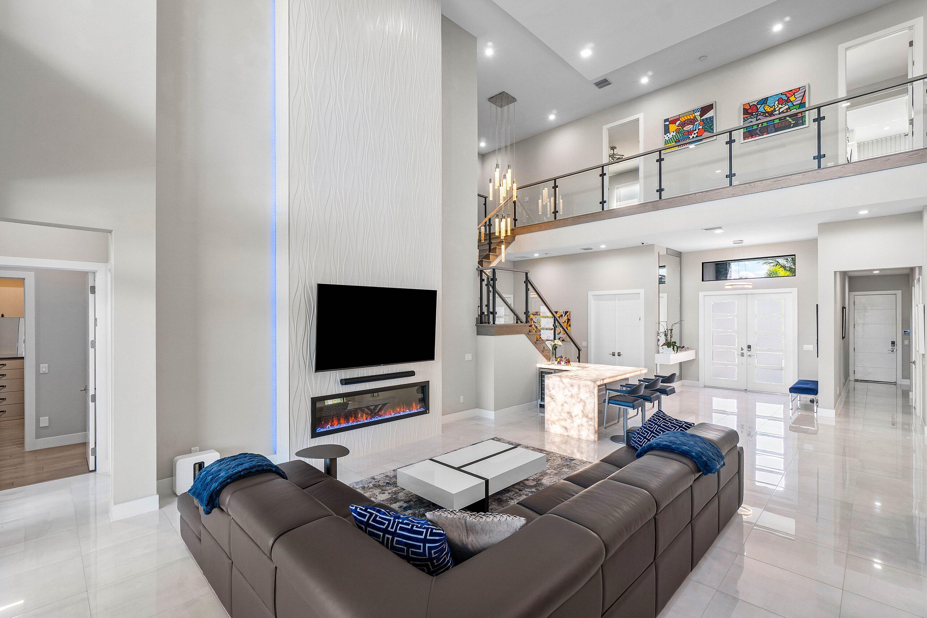 9657 Vescovato Way Boca Raton, FL 33496 - Photo 9 of 68 a living room with furniture and a flat screen tv