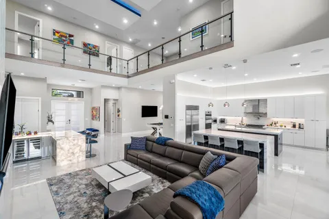 a view of living room with furniture and flat screen tv