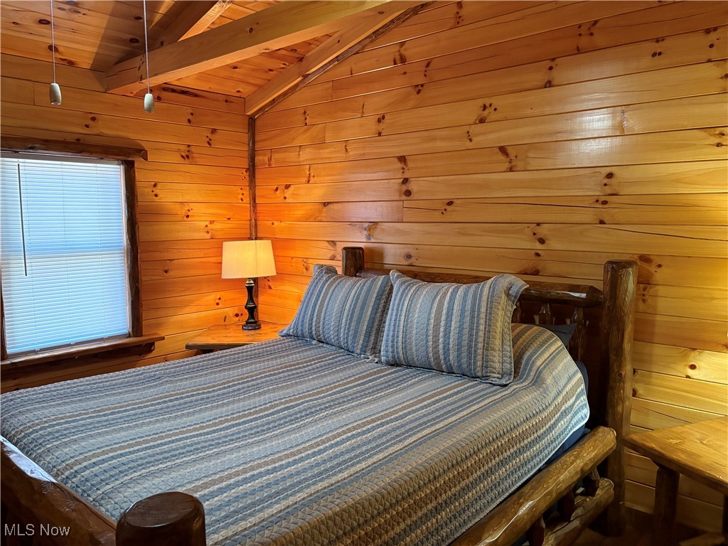 5919 Lake Road West, Unit 7 Ashtabula, OH 44004 - Photo 16 of 29 Bedroom with wooden ceiling, and wood walls