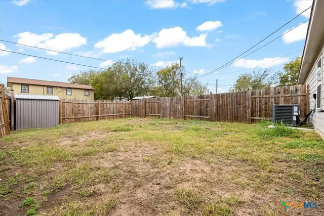 a view of a backyard with a garden and plants