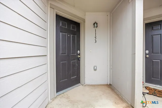 a kitchen with a sink and stainless steel appliances