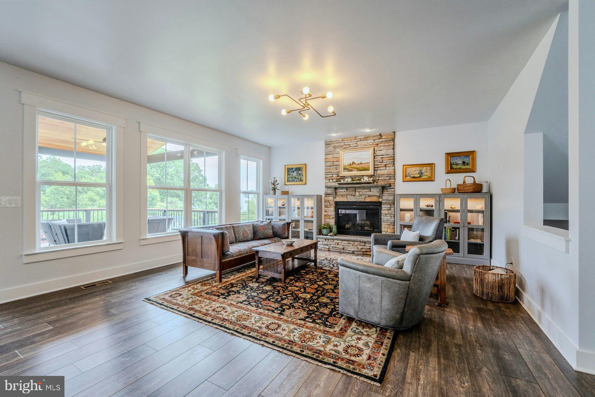 18120 Ridgewood Place Round Hill, VA 20141 - Photo 5 of 46 a living room with furniture and a fireplace
