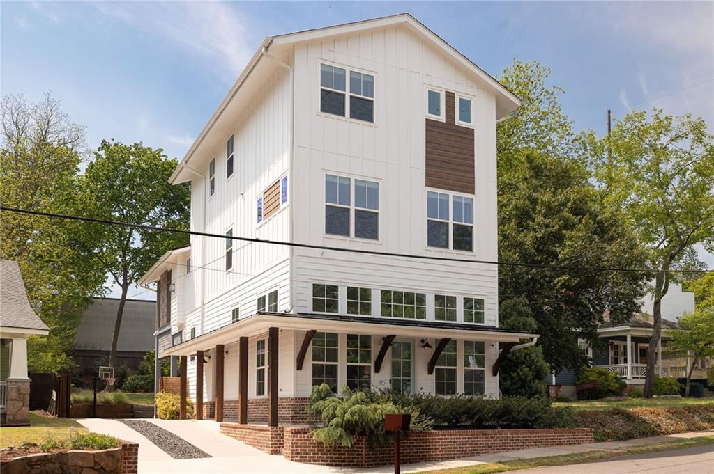a front view of a residential apartment building with a yard