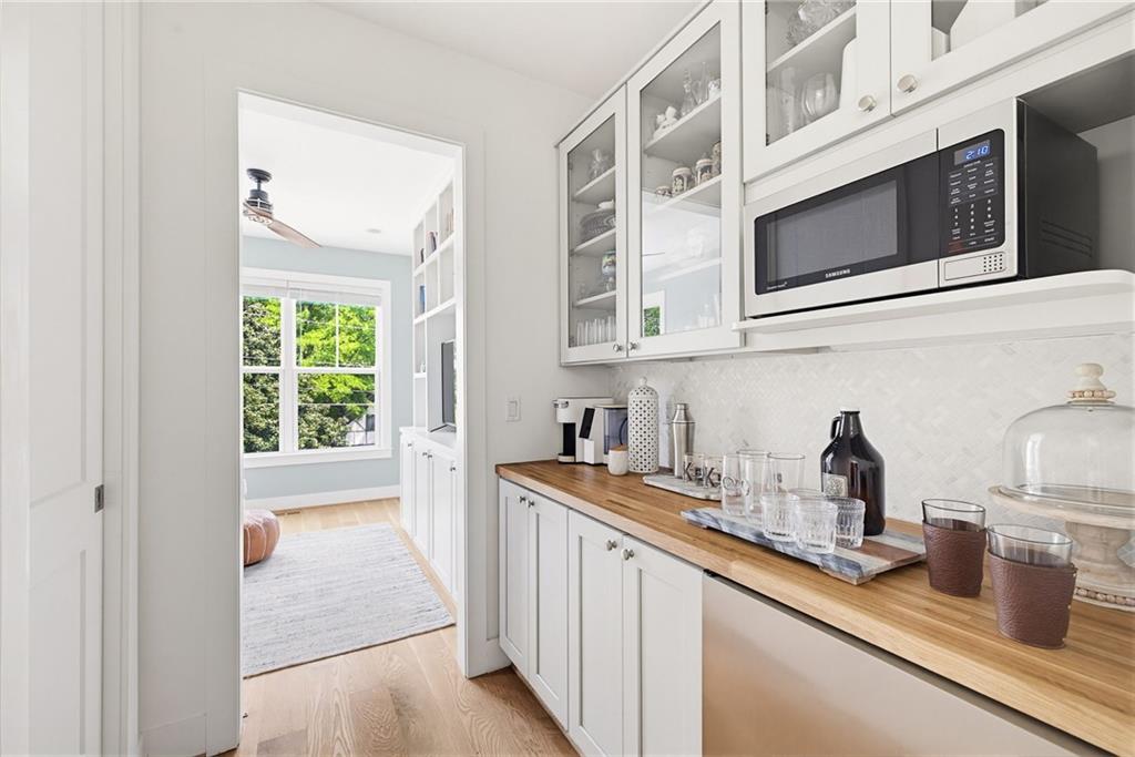 115 South Columbia Drive Decatur, GA 30030 - Photo 11 of 36 a kitchen with stainless steel appliances granite countertop a sink and a microwave
