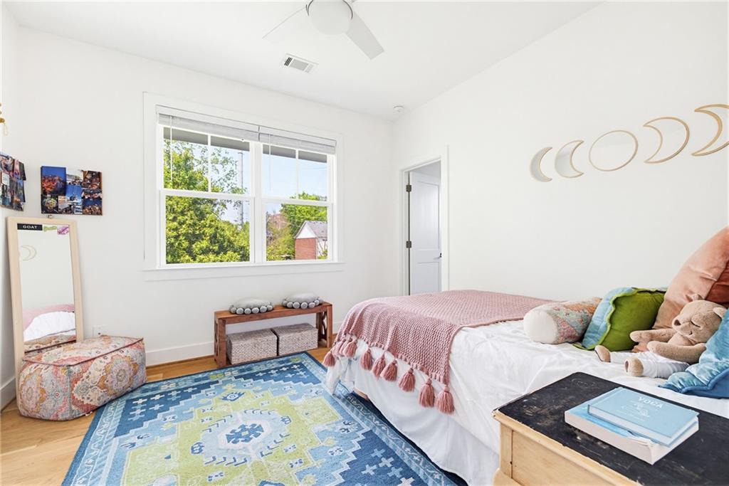 115 South Columbia Drive Decatur, GA 30030 - Photo 22 of 36 a bedroom with a bed and window