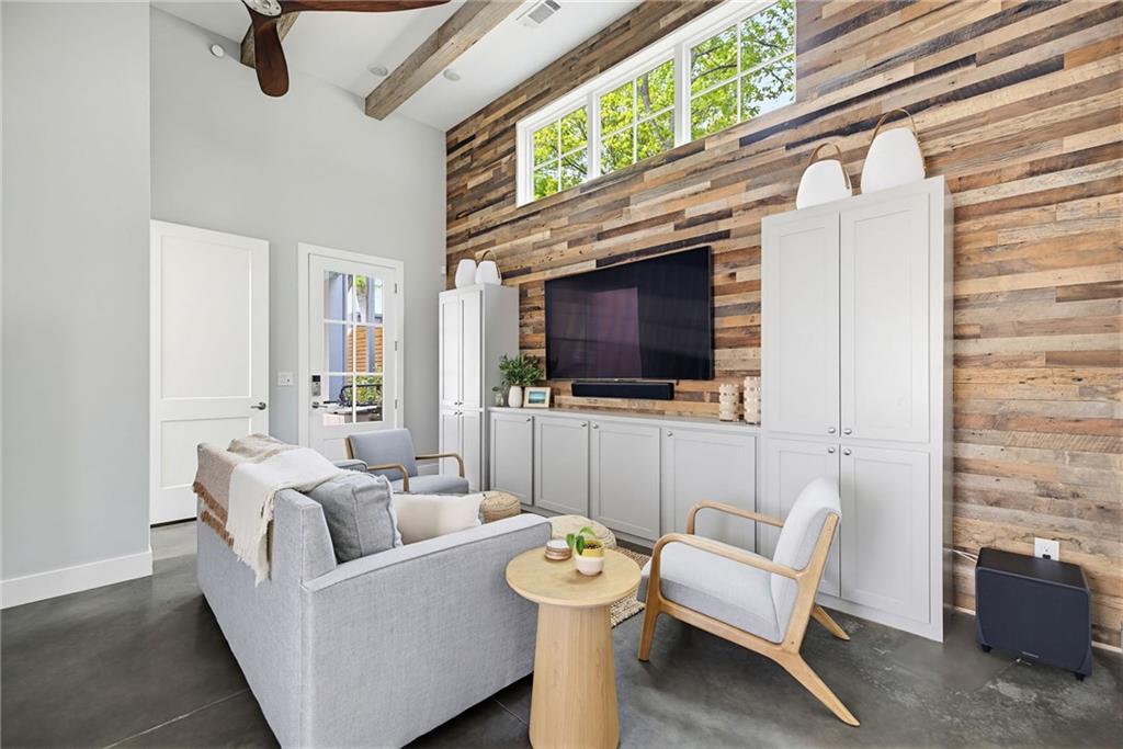 115 South Columbia Drive Decatur, GA 30030 - Photo 27 of 36 a living room with furniture a flat screen tv and a fireplace