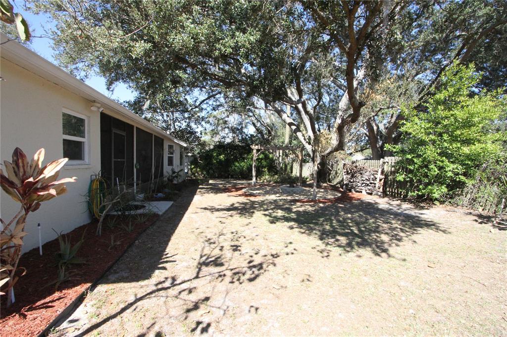 1414 Norwick Drive Lutz, FL 33559 - Photo 36 of 43 a view of backyard of house with green space