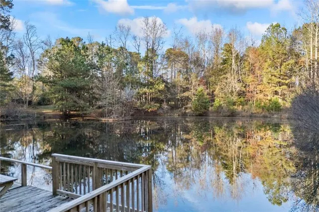a view of a small house with a yard