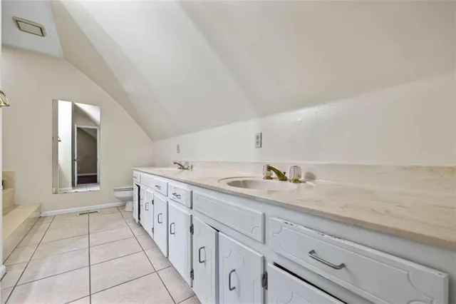 a white bath tub sitting next to a shower