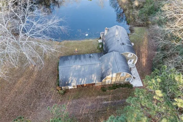a view of wooden house with a large window
