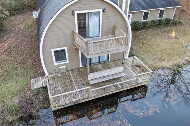 a front view of house with a garden