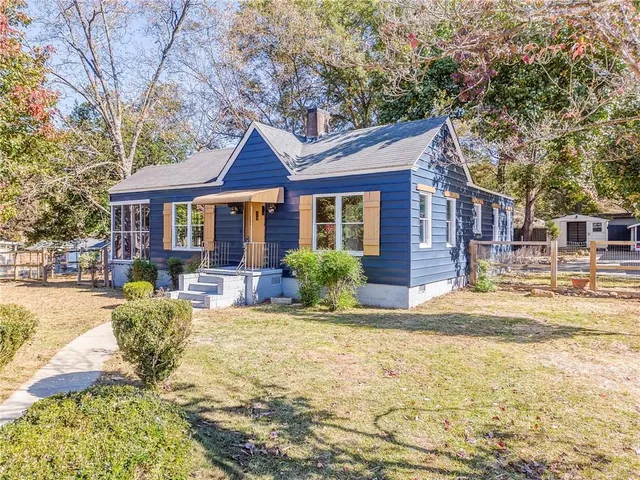 a house view with swimming pool and porch