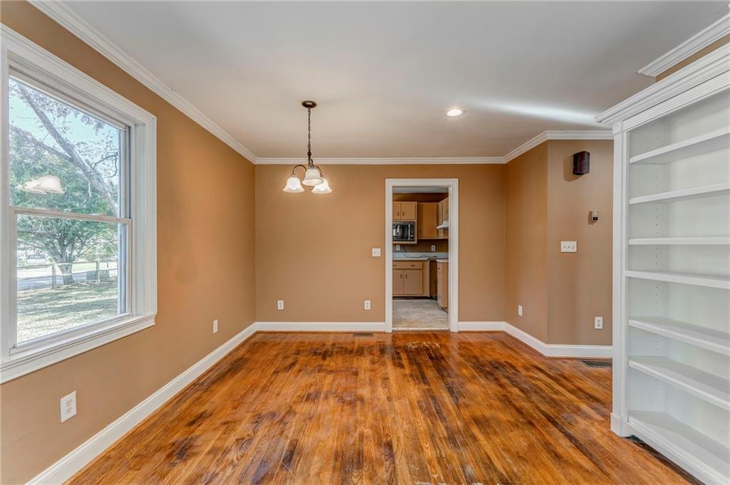 2501 Maple Road Southeast Rome, GA 30161 - Photo 17 of 56 a view of empty room with wooden floor and window