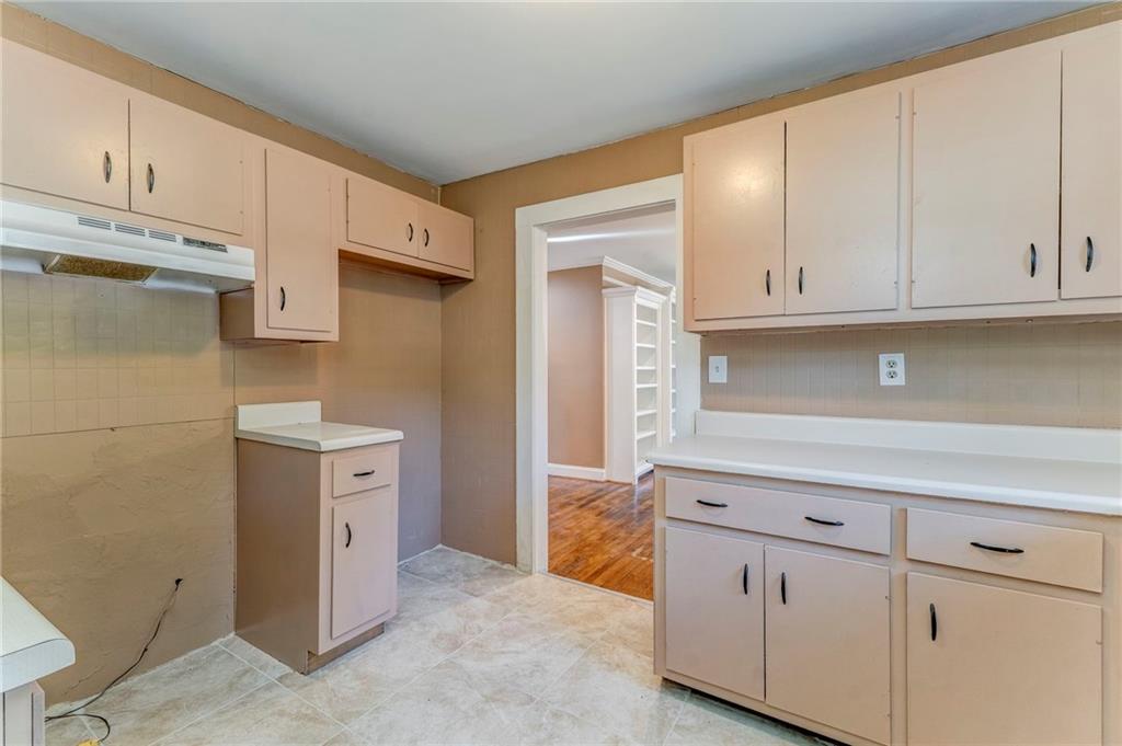 2501 Maple Road Southeast Rome, GA 30161 - Photo 23 of 56 a kitchen with stainless steel appliances white cabinets and a sink