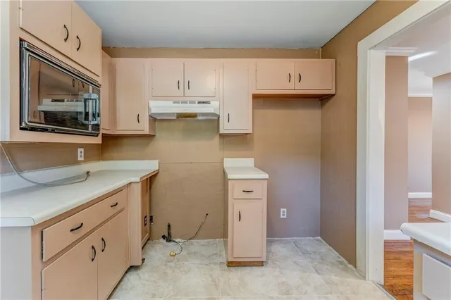 a view of kitchen with furniture and window