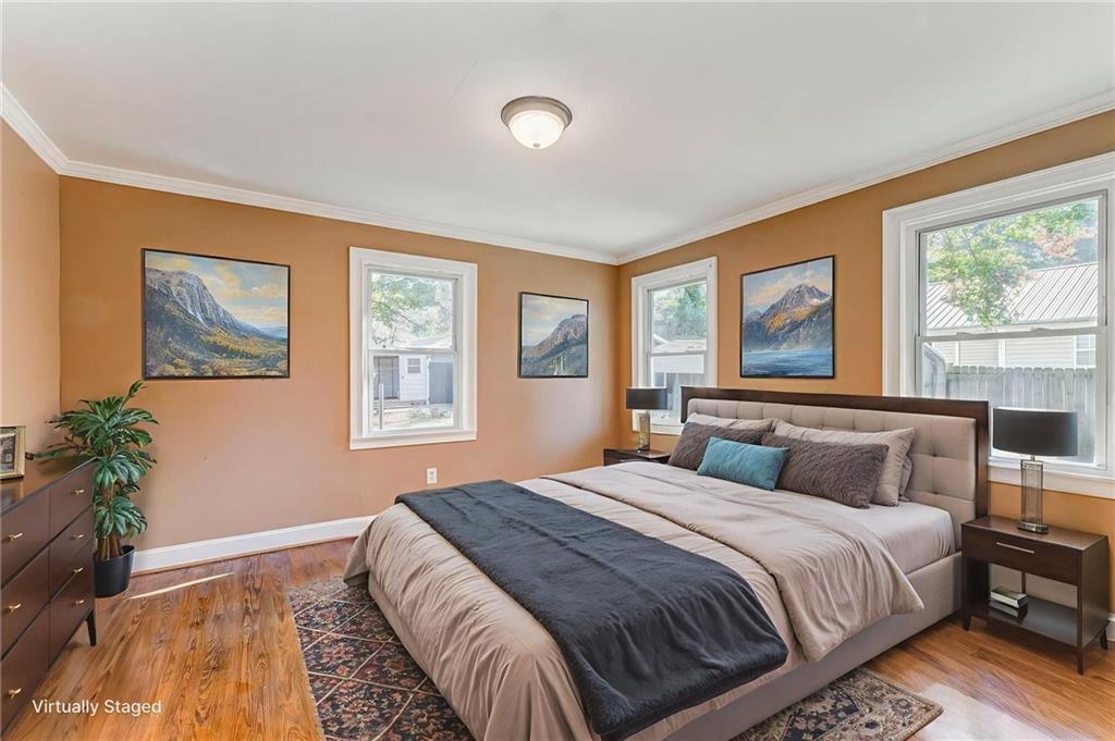 2501 Maple Road Southeast Rome, GA 30161 - Photo 29 of 56 a bedroom with a large bed and a potted plant