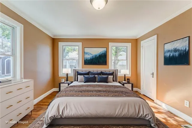 a white bath tub sitting next to a toilet