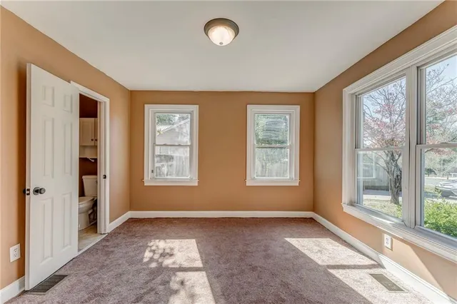 a view of an empty room and window