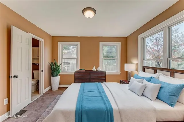 a view of a house with a yard covered in snow