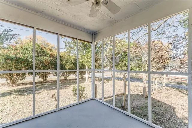 a view of a house with a yard and trees