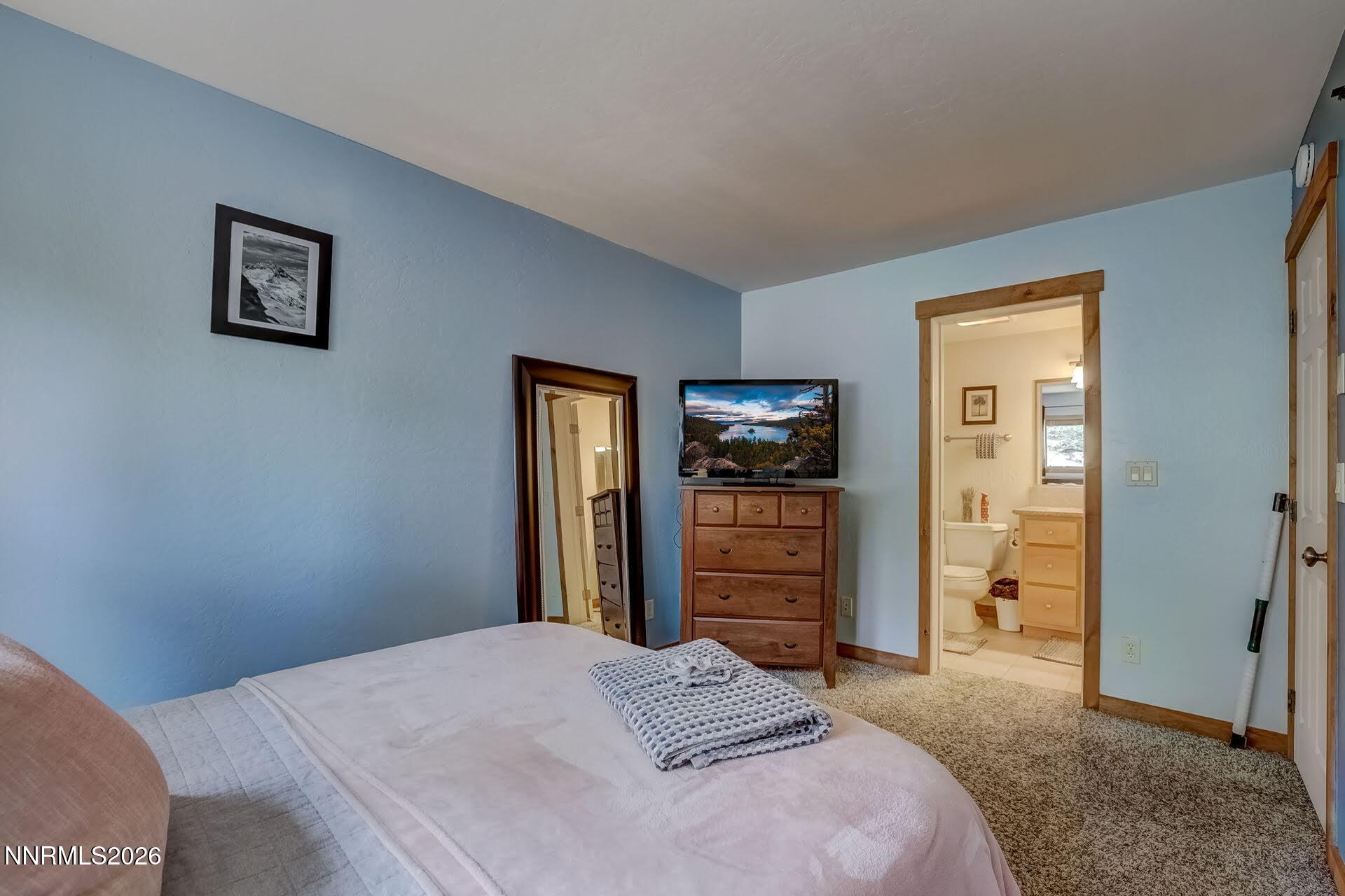 495 Tramway Drive, Unit 7 Stateline, NV 89449 - Photo 15 of 31 a bedroom with a bed and a dresser