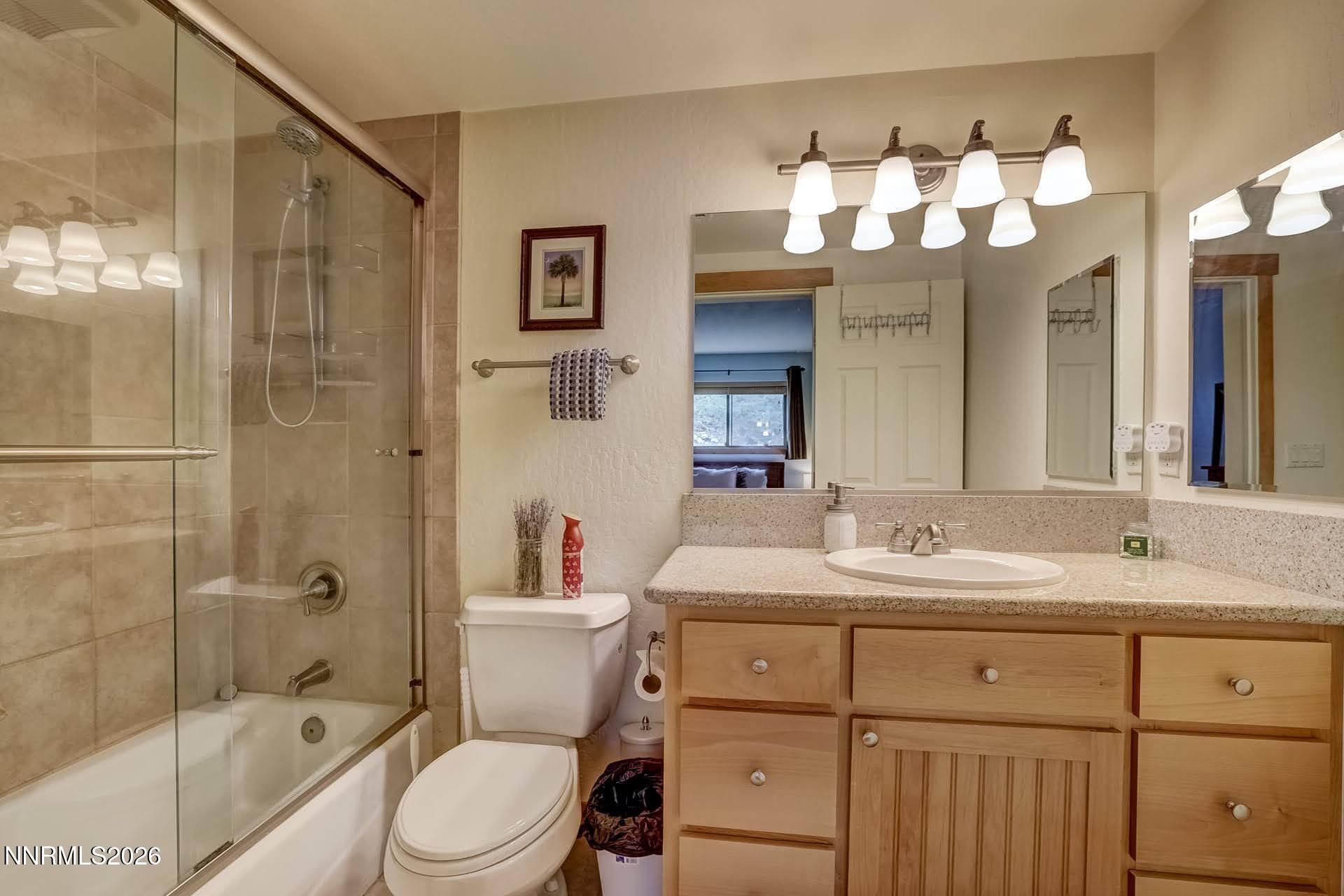 495 Tramway Drive, Unit 7 Stateline, NV 89449 - Photo 16 of 31 a bathroom with a sink a toilet and shower