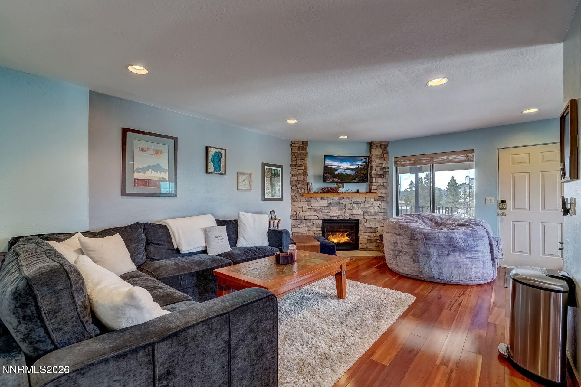 495 Tramway Drive, Unit 7 Stateline, NV 89449 - Photo 7 of 31 a living room with furniture and a fireplace