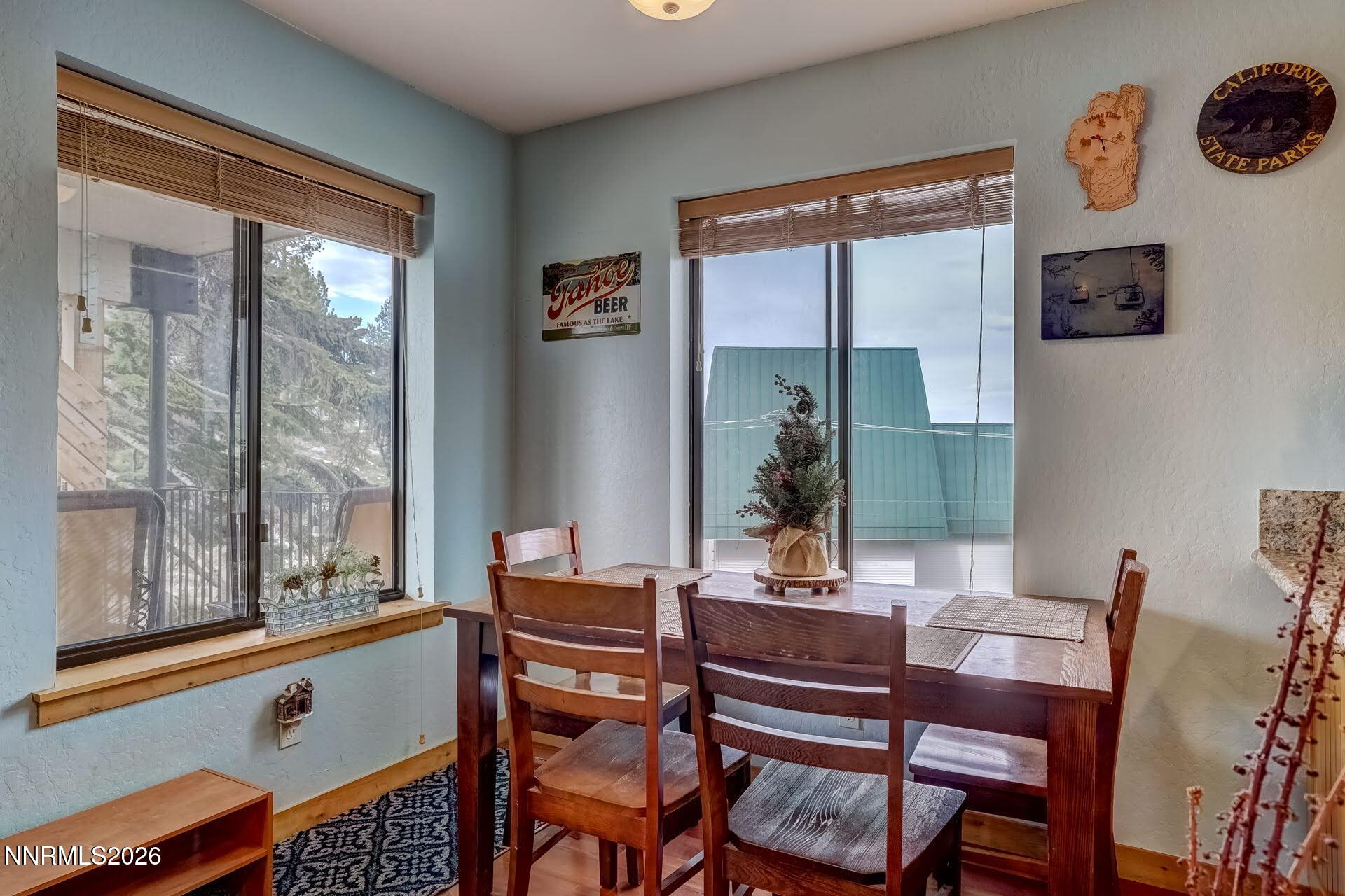 495 Tramway Drive, Unit 7 Stateline, NV 89449 - Photo 8 of 31 a dining room with furniture and a window
