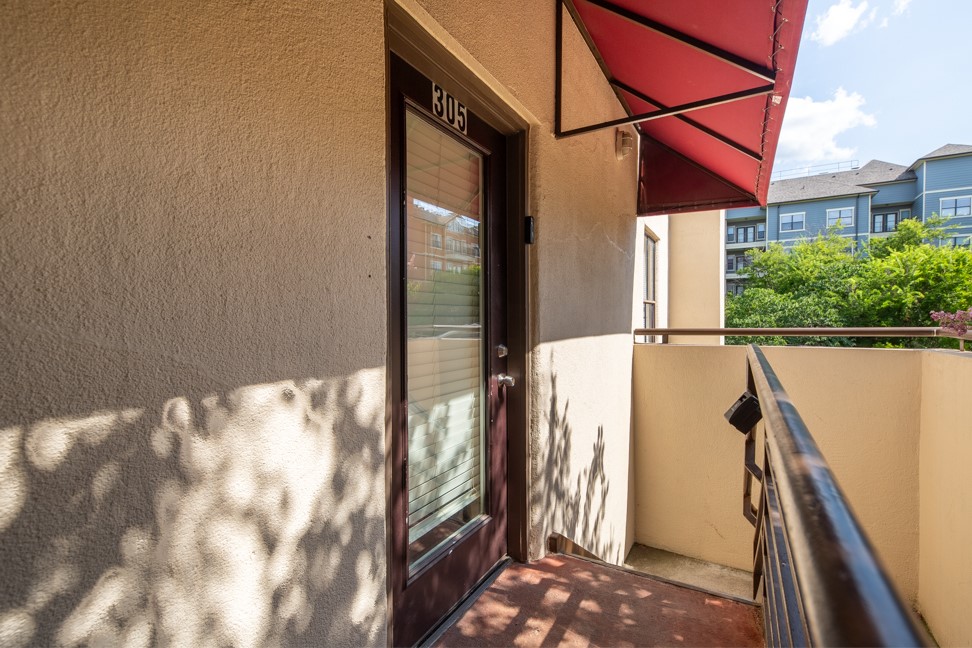 712 Graham Place, Unit 305 Austin, TX 78705 - Photo 1 of 18 Entrance to property with stucco siding and a balcony