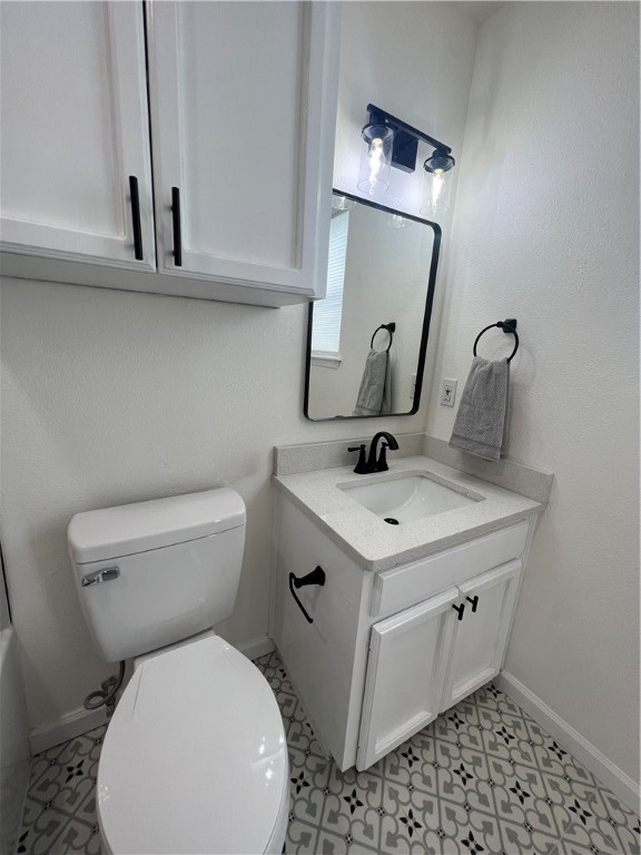 Undisclosed Address Corpus Christi, TX 78418 - Photo 15 of 20 a bathroom with a toilet sink and mirror