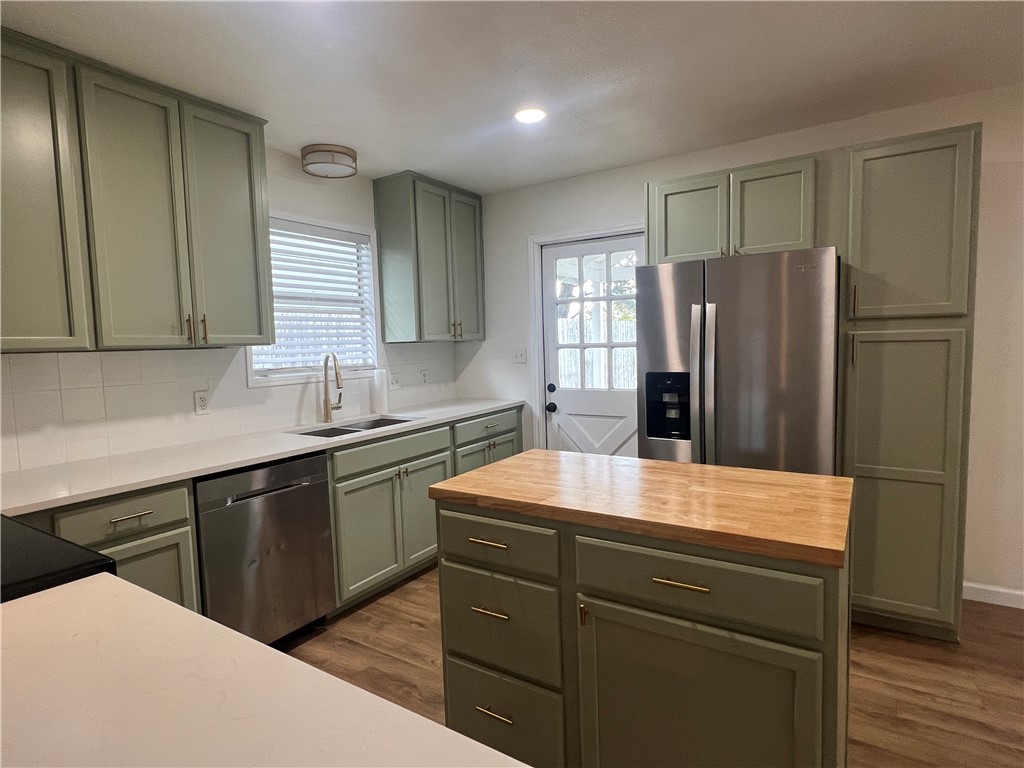 Undisclosed Address Corpus Christi, TX 78418 - Photo 7 of 20 a kitchen with a refrigerator and a sink