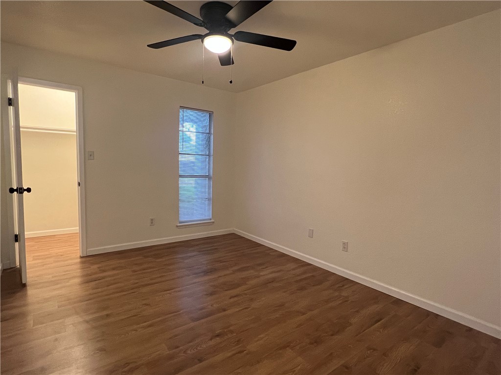 Undisclosed Address Corpus Christi, TX 78418 - Photo 9 of 20 an empty room with wooden floor and windows